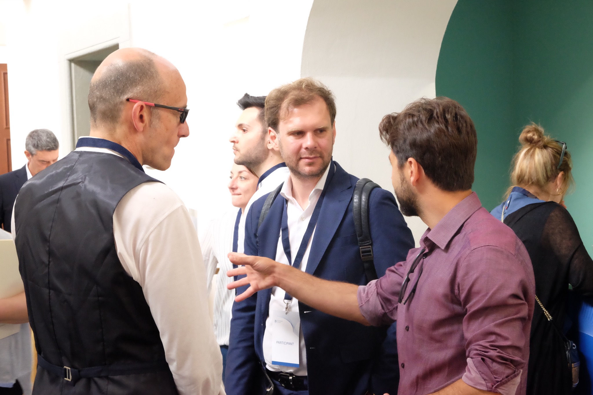 Researchers and investors in focused discussion